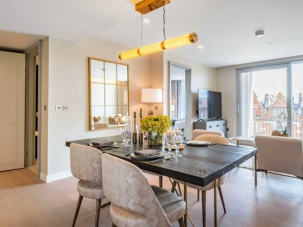 Elegant dining area at Garret Mansions, London, featuring a modern interior design and a spacious layout.