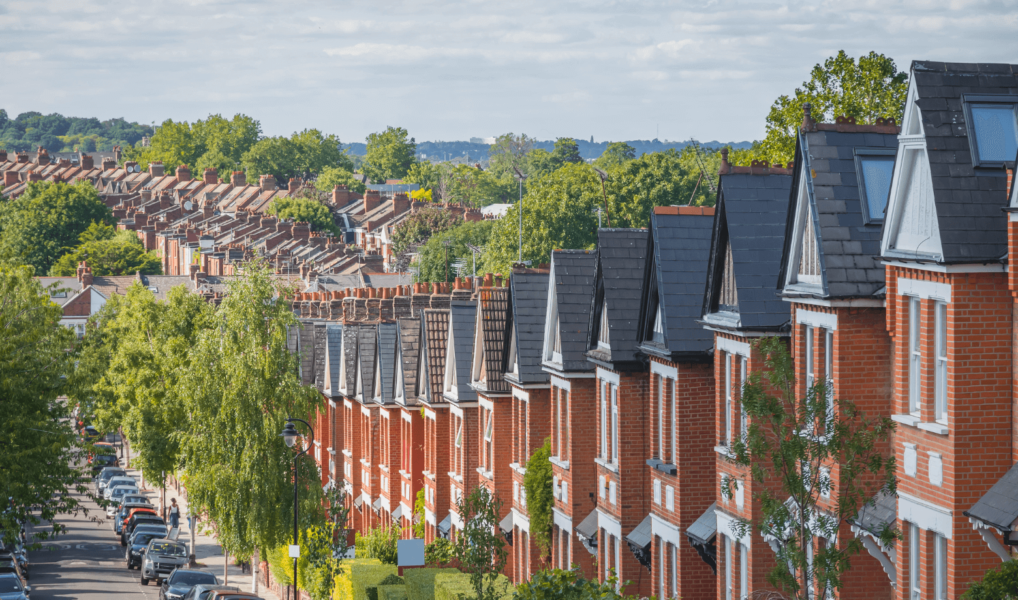 Traditional red-brick terraced homes in London.